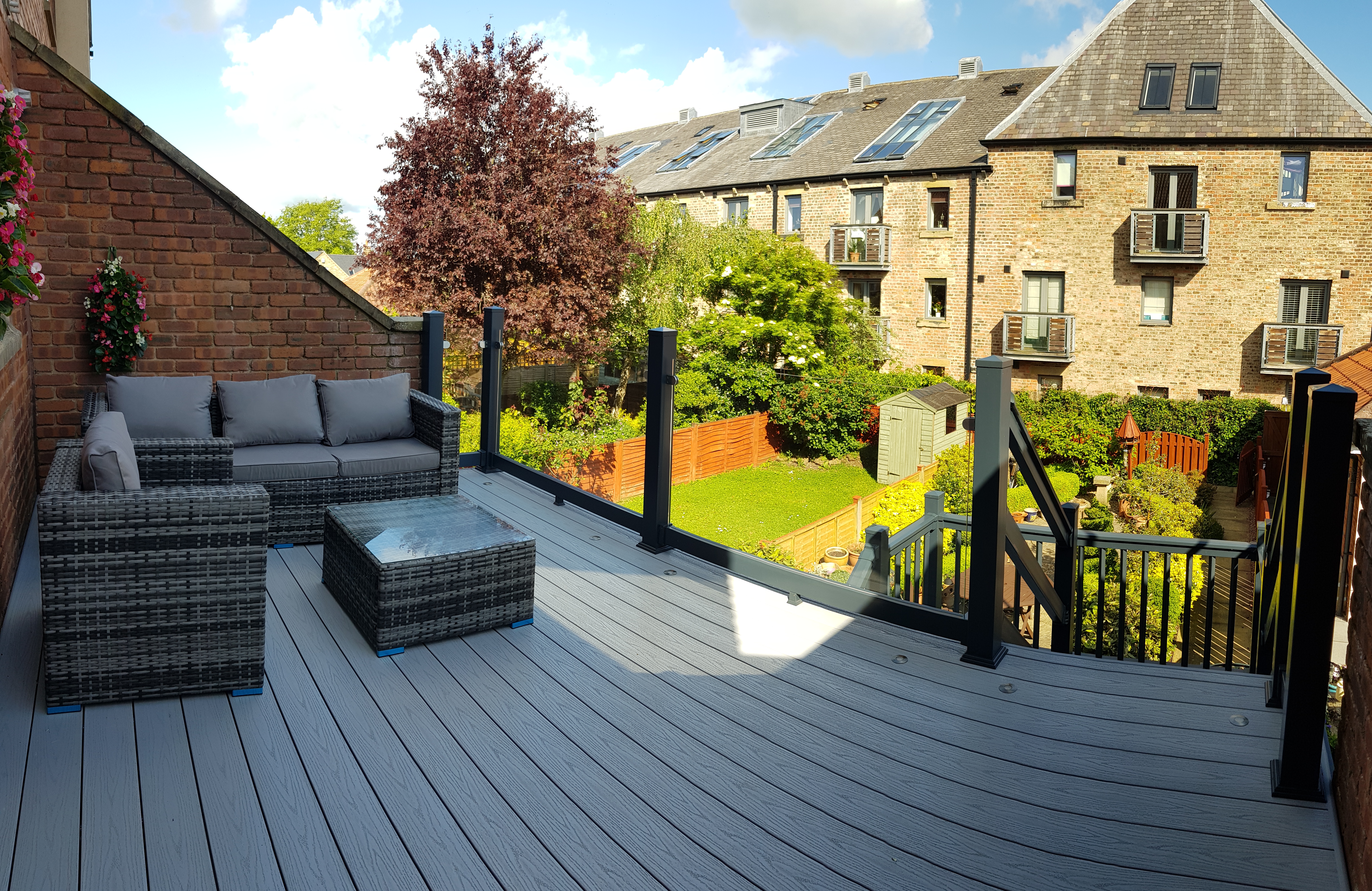 Raised grey deck with glass balustrade